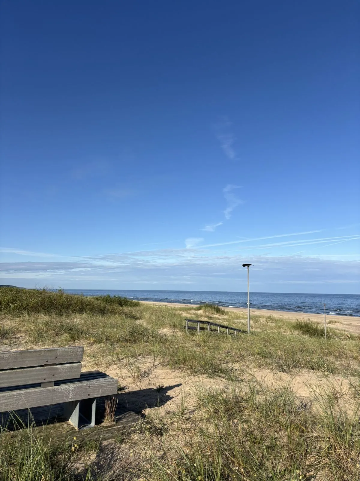 Benches on the dune, facing west over the sea
