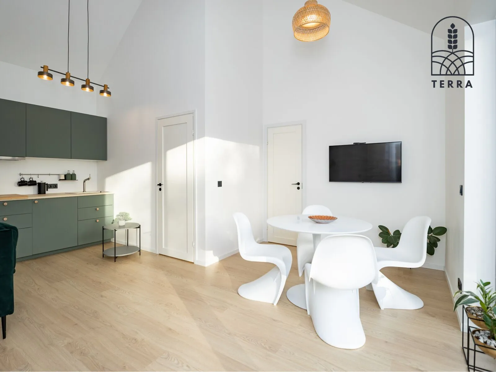 Kitchen and dining table in apartment 1 of Terra House