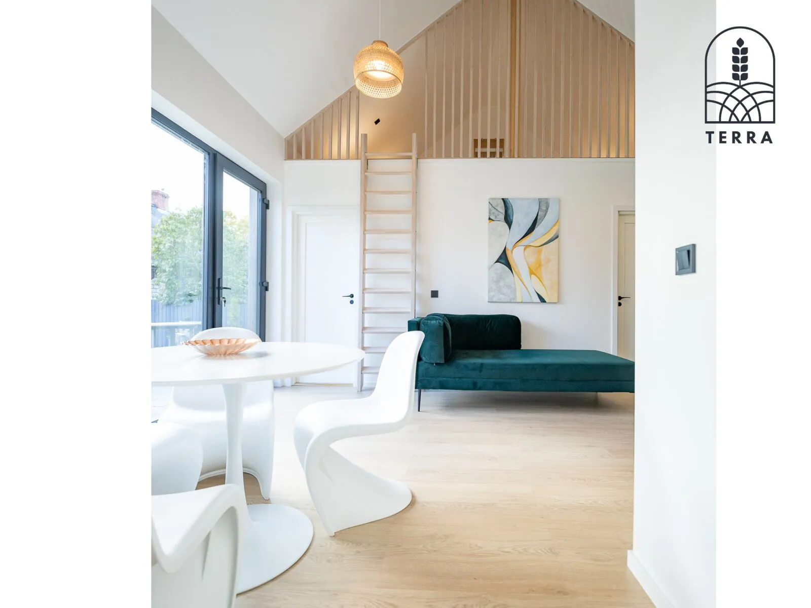 The living room and the ladder to the loft — Terra House, Ventspils